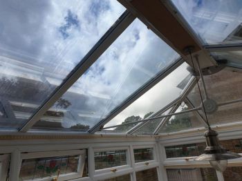 1. Anti heat/glare film to conservatory roof. Crawley - Surrey