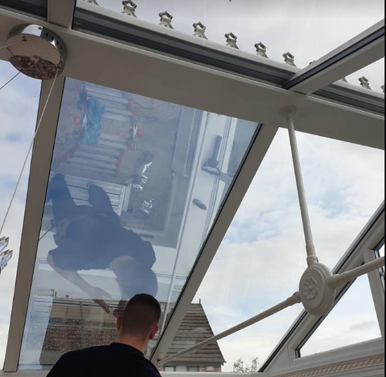 Conservatory with heat reduction film applied