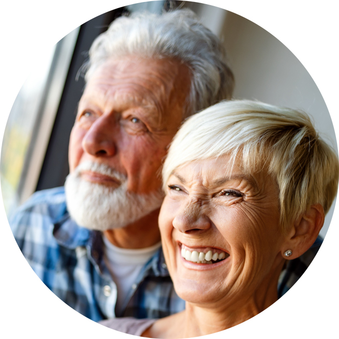 old couple looking out of conservatory window